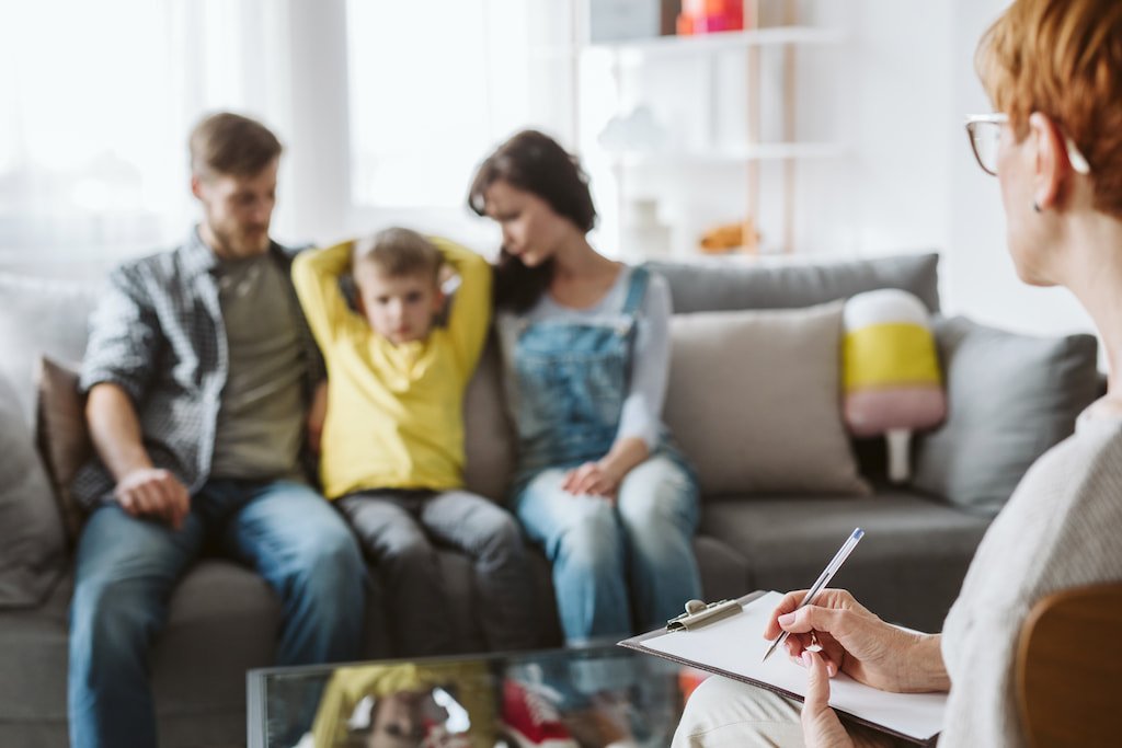 A family in conversation with a support professional