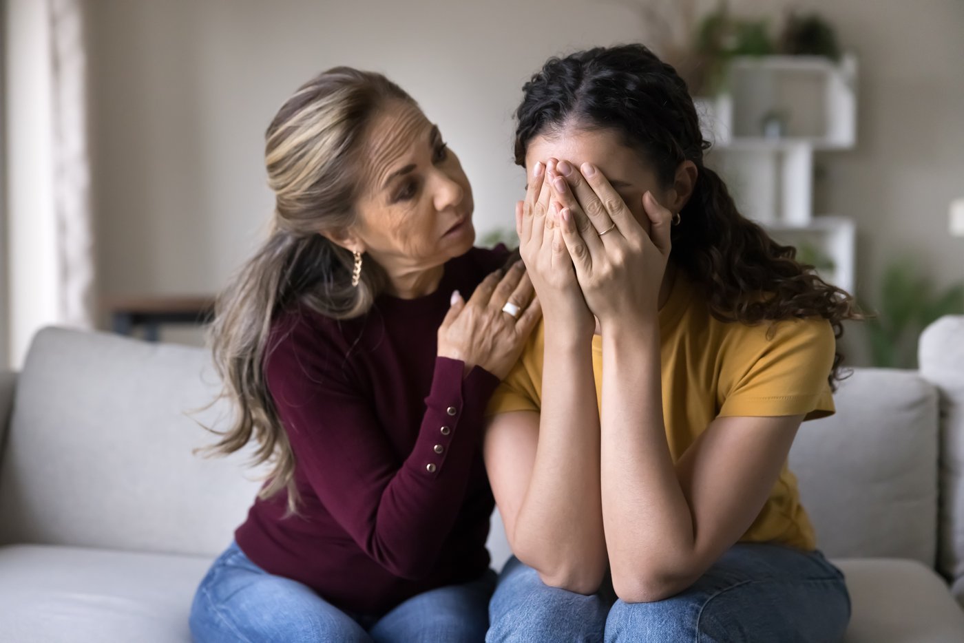 A woman comforting someone experiencing distress