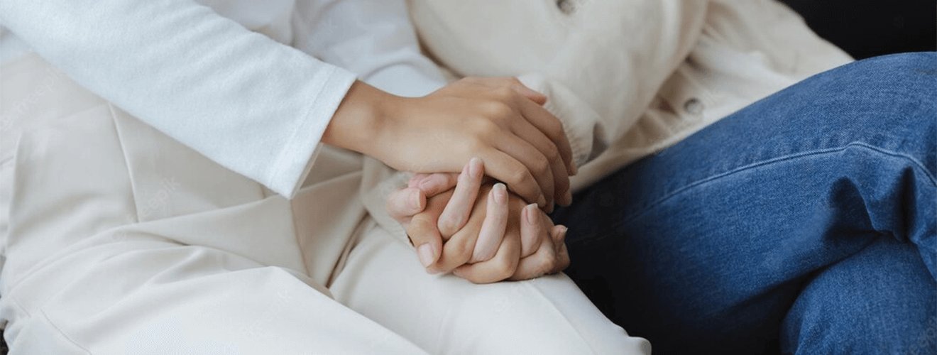 Hands held together in a gesture of reassurance