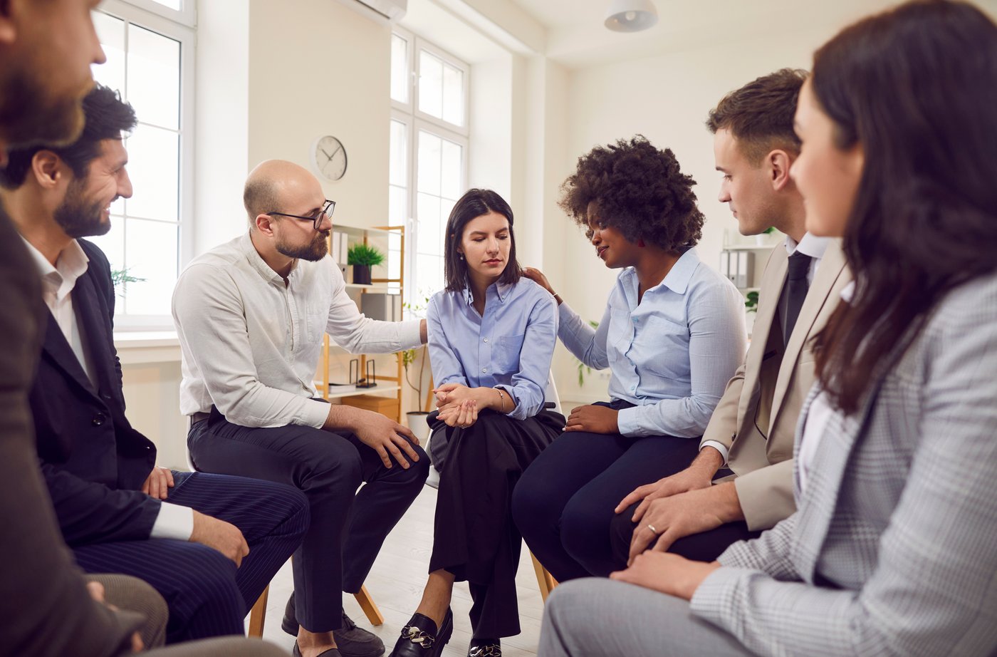 A small group sitting together for a supportive conversation
